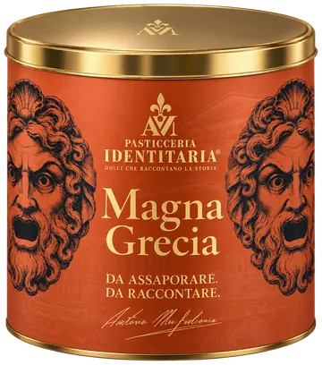 La latta color terracotta del panettone Magna Grecia, con le due maschere del teatro antico